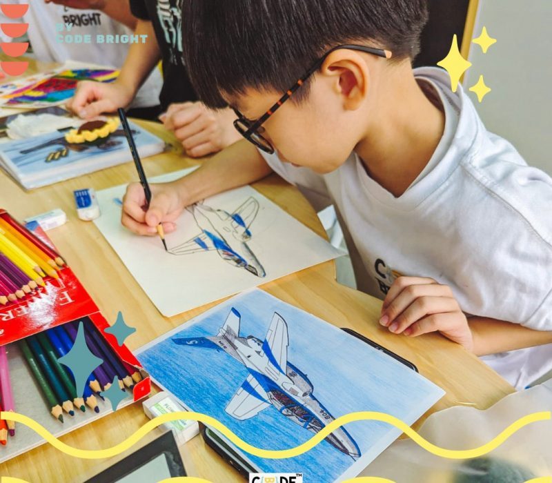 Children in Code Bright's art class in Singapore focused on painting colorful aircraft illustrations with pencils and watercolors.